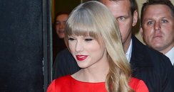 Taylor Swift wearing a red dress