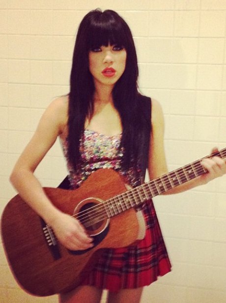 Craly Rae Jepsen playing the guitar