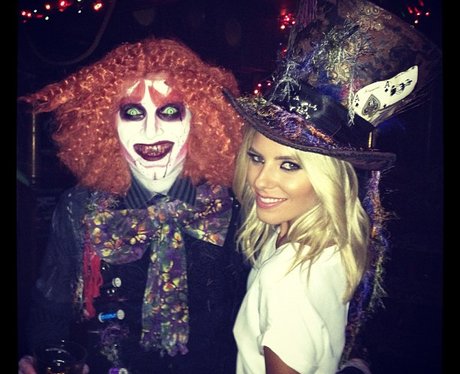 Mollie King wearing a top hat