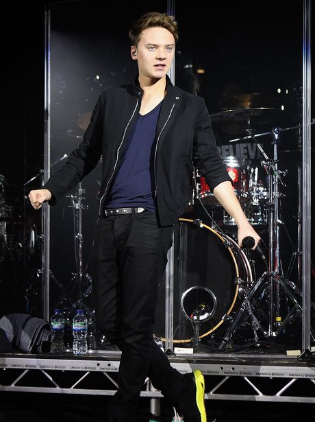 Conor Maynard wearing black during live performance
