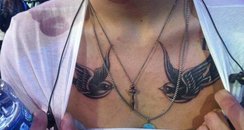 Harry Styles shows off new swallow tattoo's