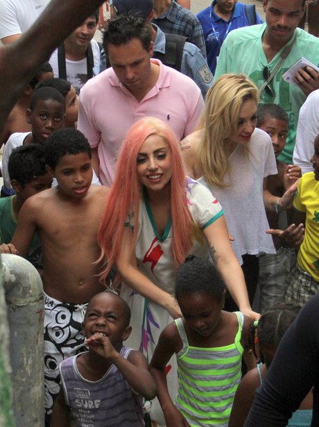 Lady Gaga visits slums in Rio and is mobbed by fans
