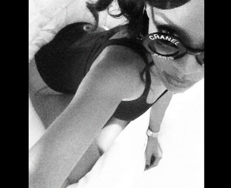 Rihanna wearing a black leotard