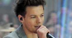 Louis Tomlinson of One Direction performs on NBC's