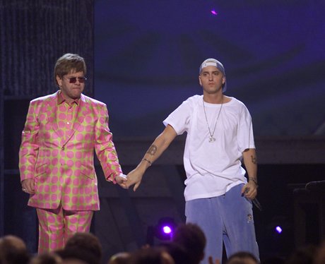 Elton John and Eminem holding hands