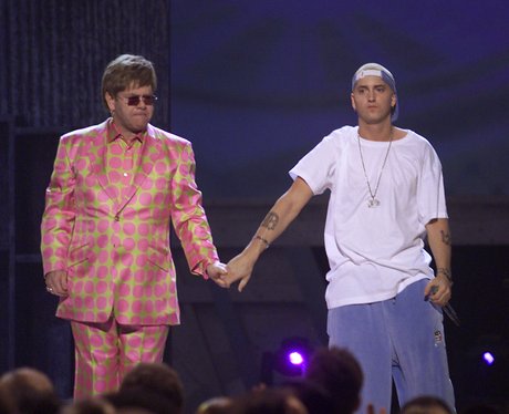 Elton John and Eminem holding hands