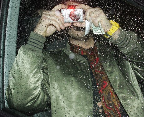 Robbie Williams Hides Behind Camera