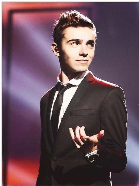 The Wanted on stage in black suit