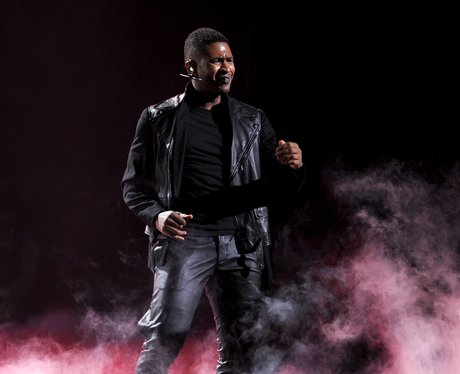 Usher performs on stage