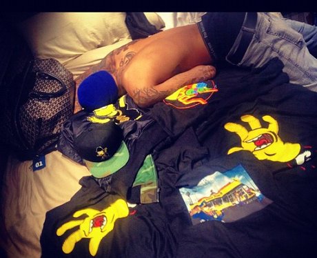 Chris Brown asleep on Rihanna's bed
