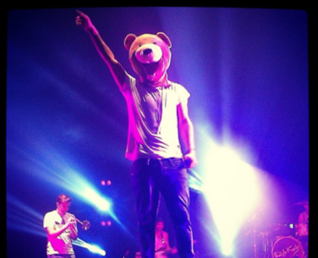 Rizzle Kicks wears a bear mask on stage