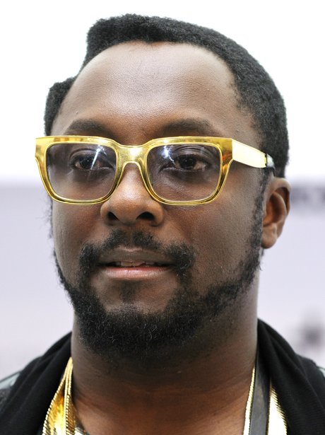Will.i.amw earing gold rimmed glasses