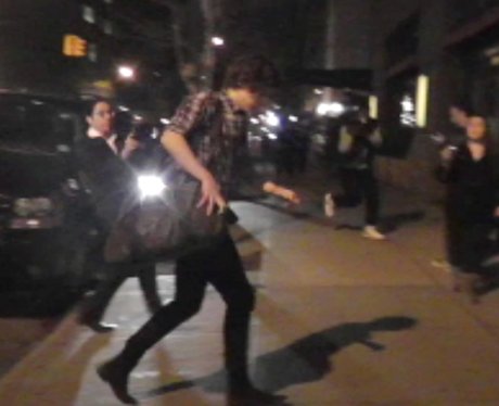 Harry Styles arriving at Taylor Swift's hotel
