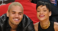 Rihanna and Chris Brown watching basketball togeth