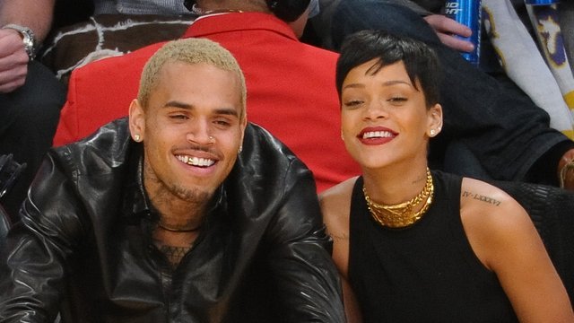 Rihanna and Chris Brown watching basketball togeth