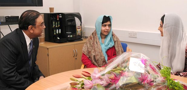Malala Yousafzai with flowers at the QE Hospital