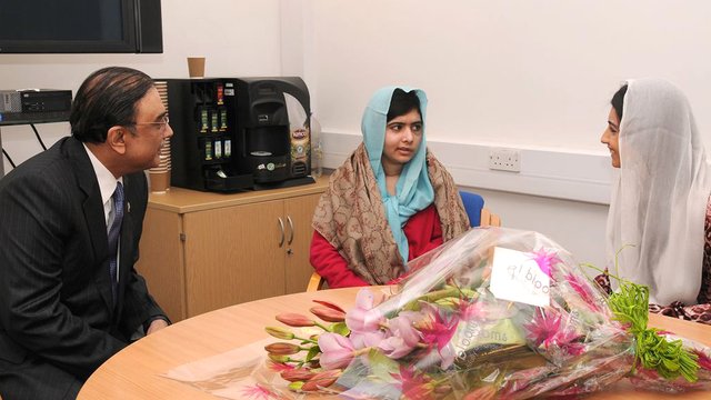 Malala Yousafzai with flowers at the QE Hospital