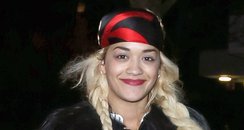 Rita Ora wearing a black fur coat