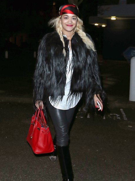 Rita Ora wearing a black fur coat