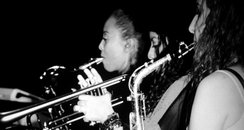 Beyonce playing a saxaphone