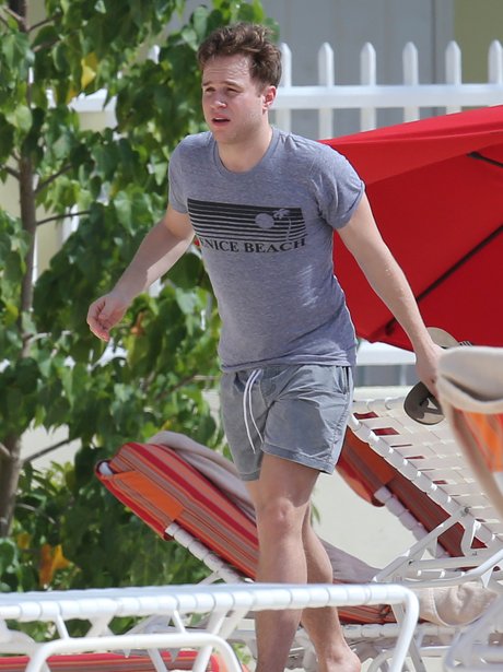 Olly Murs wearing a t-shirt on the beach in the Caribbean