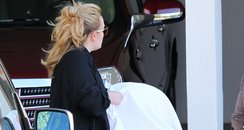 Adele carrying her baby in America