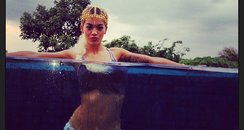 Rita Ora in a pool on holiday