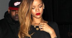 Rihanna wearing a black see-through dress