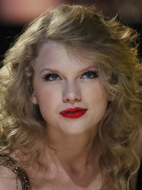 Taylor Swift gives the camera a pout in one of her music videos