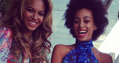 Beyonce and Solange smiling before Grammy Awards