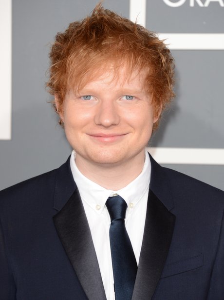 Ed Sheeran wearing a navy suit at Grammy Awards 2013
