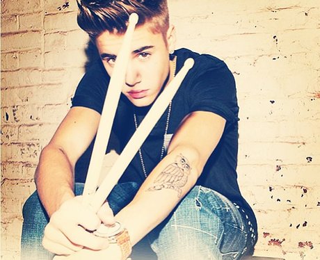 Justin Bieber with drum sticks