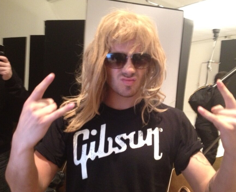 Max George wearing a blonde wig