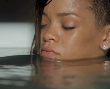 Rihanna sitting back in stay video bath tub