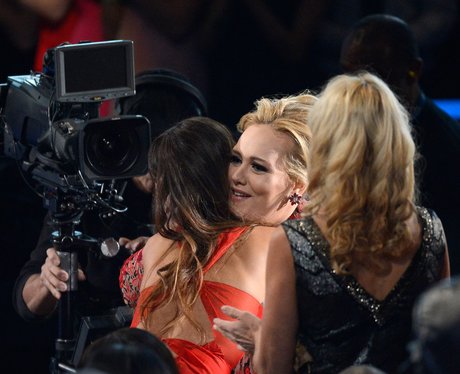 Rihanna and Adele hug at the 2013 Grammy Awards