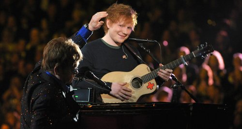 Sir Elton John and Ed Sheeran perform on stage at 