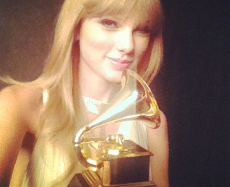 Taylor Swift shows off her Grammy Award