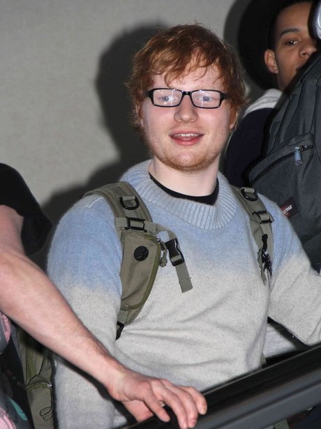 Ed Sheeran wearing glasses at LAX airport