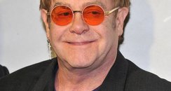 Elton in orange glasses