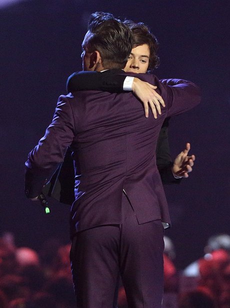 On Direction and Robbie Williams on stage a