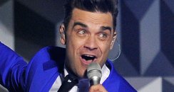 Robbie Williams live on stage at the BRIT Awards 2