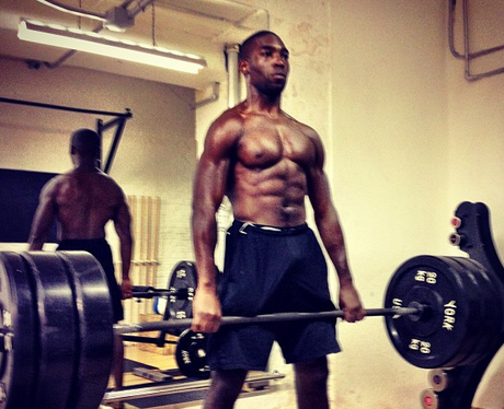 Tinie Tempah lifting weights in the gym