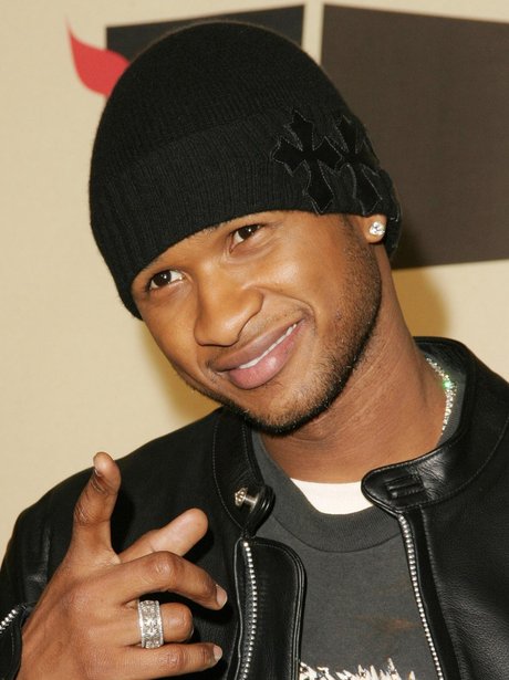 Usher wearing a beanie hat