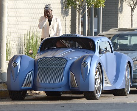 Will.i.am next to his custom made car