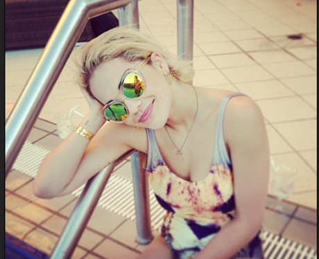 Rita Ora by the pool after performing in Australia