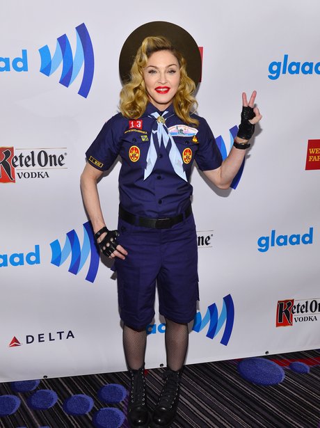 Madonna wearing a scout outfit