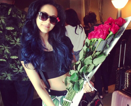 Jade Thirlwell holding roses from her boyfriend