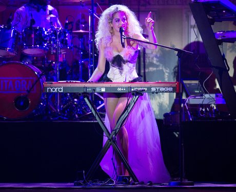 Rita Ora playing the keyboard