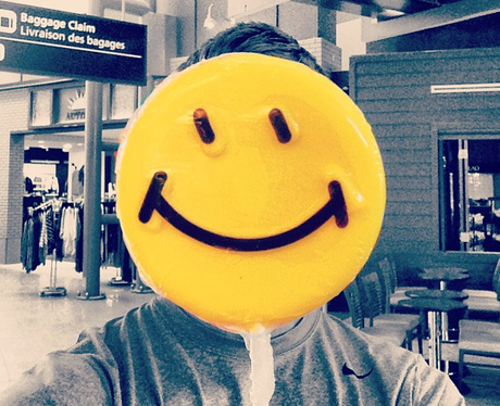 Calvin Harris covers up his face with a smile