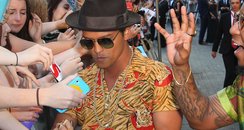 Bruno Mars is greeted by fans